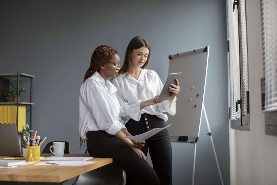 beautiful women working together startup company
